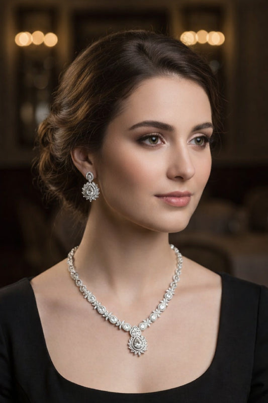 Classic Silver-Finish Floral Medallion Necklace Set with Radiant Pear-Cut Drop Earrings