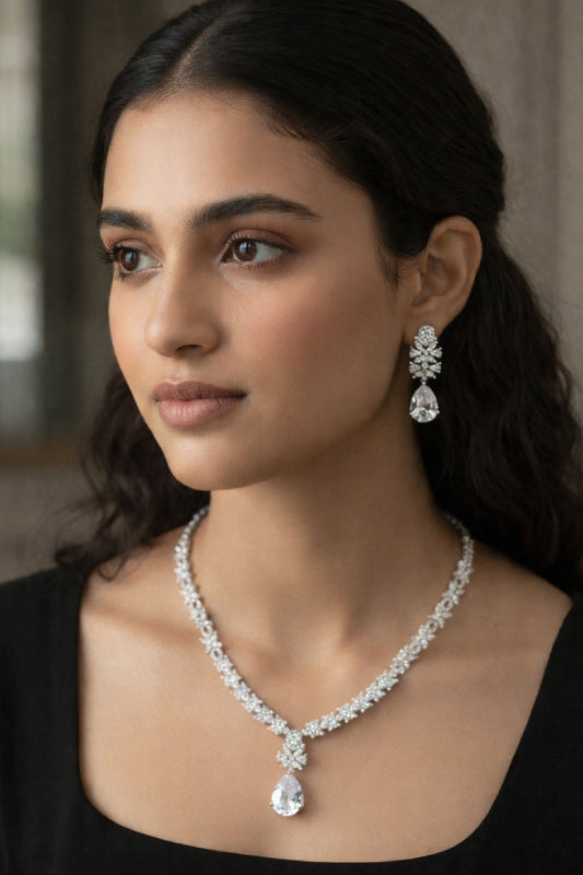 Radiant Silver-Finish Floral V-Necklace Set with Brilliant White Stone Studded Clusters
